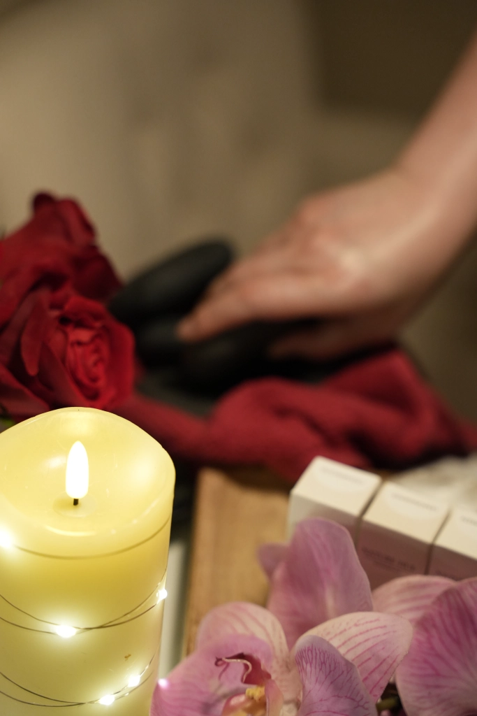 Luxsa Thai Spa therapist testing hot stone temperature for safe hot stone massage treatment in Manhattan